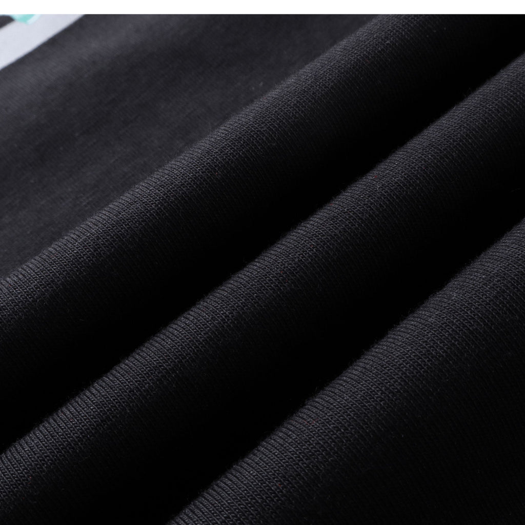 Soft breathable fabric texture of black oversized t-shirt