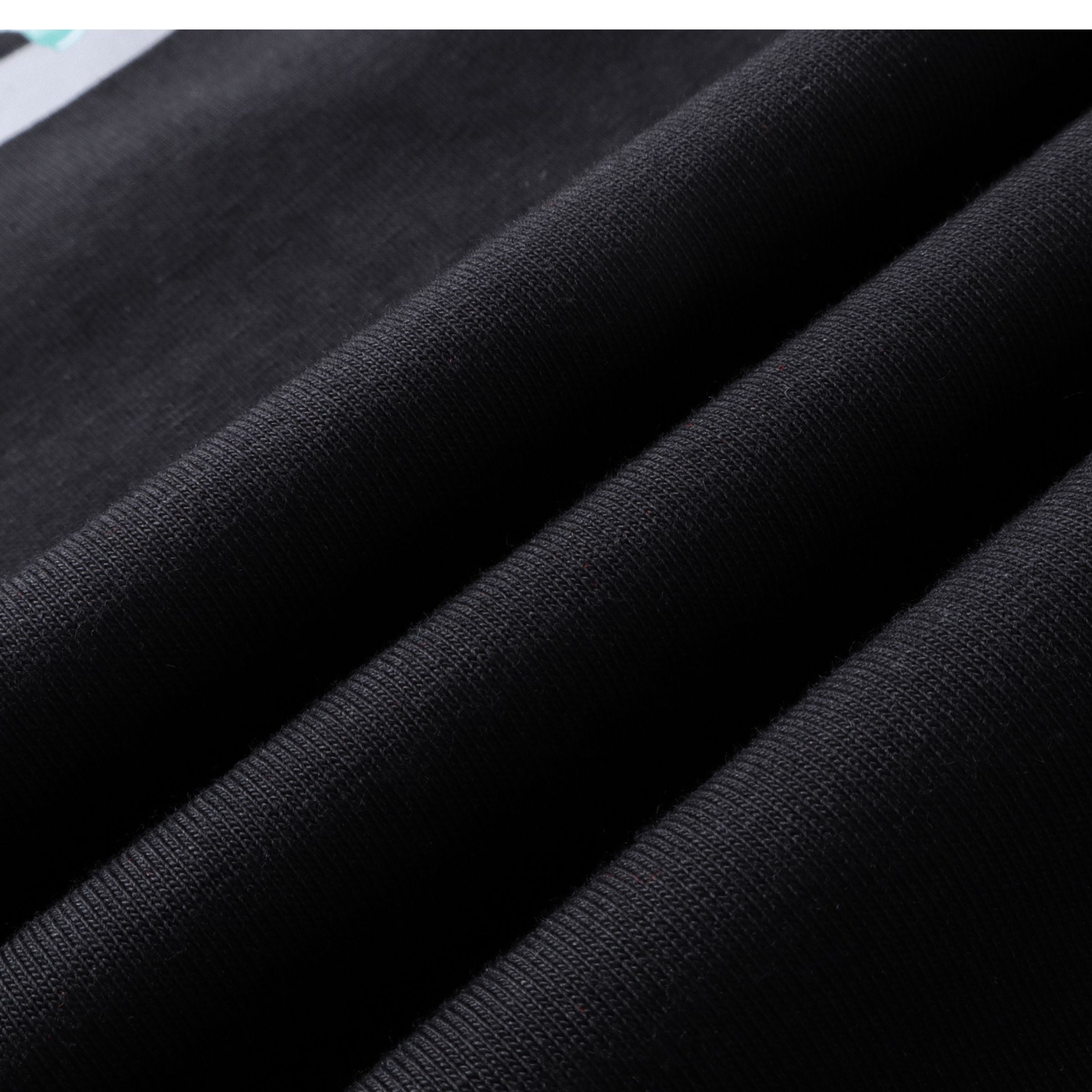 Soft breathable fabric texture of black oversized t-shirt