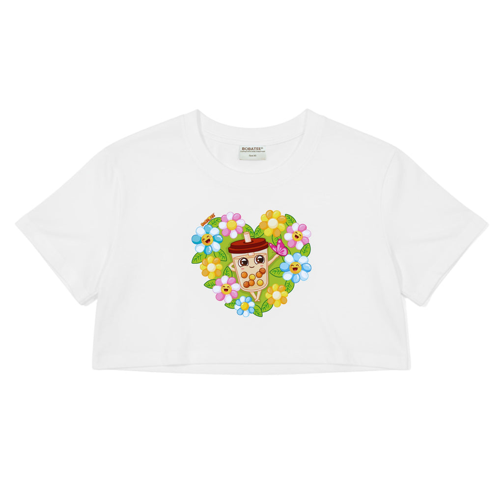 Flat lay of Garden of Cheer boba crop top showing floral graphic design and cropped silhouette