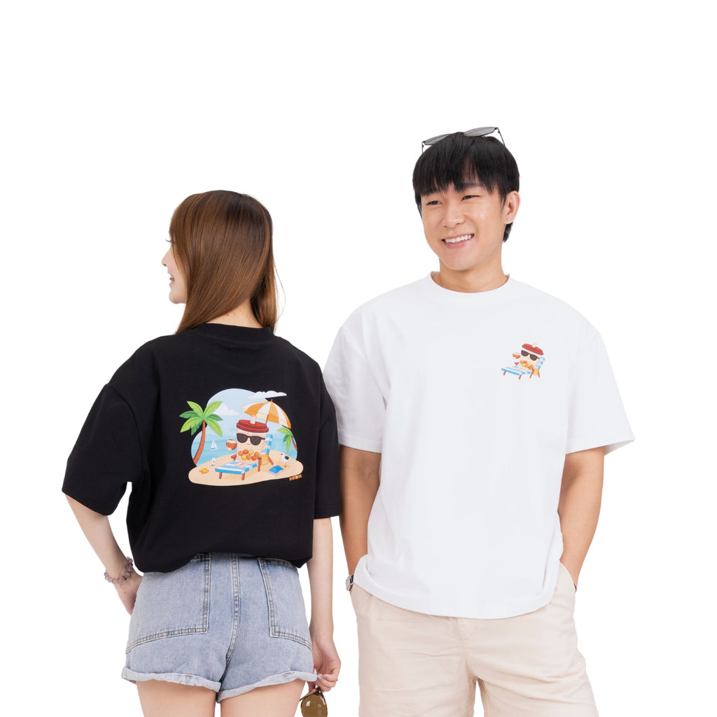 Lifestyle shot of Sun Sea and Sand oversized tee for beach days