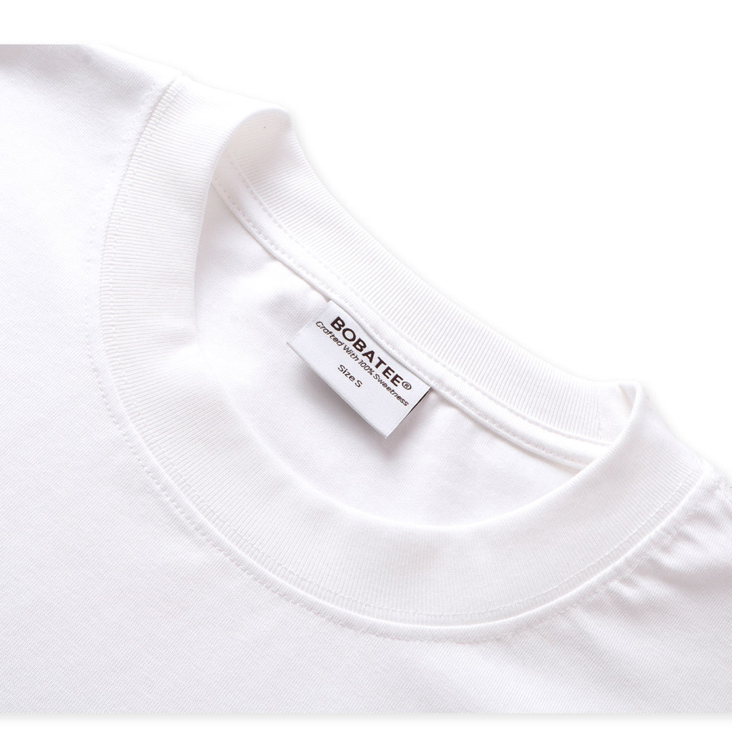 Crew neckline detail of Sun Sea and Sand oversized white tee
